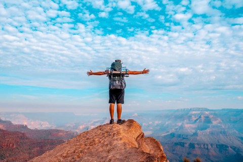 A young man on a viewpoint of the descent of the South Kaibab Trailhead. Grand Canyon