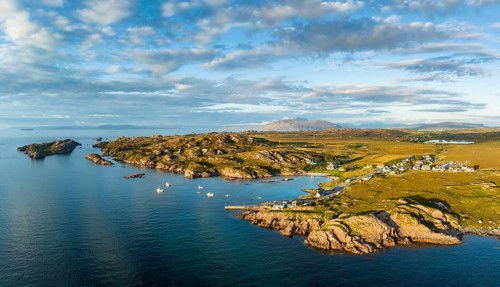Aerial panorama of the coastline of the Ross of Mull peninsula with the fishing village of Fionnphort