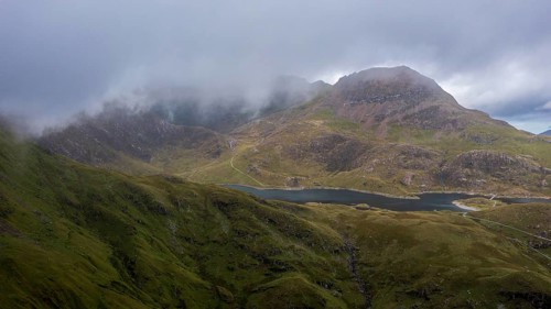 Typical landscape with Snowdon behind clouds in late summer