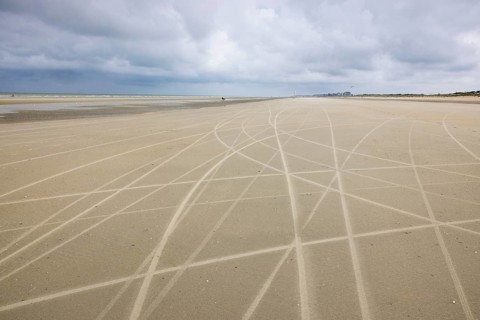 Traces of beach sailors in the sandy beach