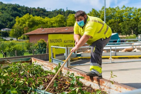 Worker in a recycling factory or clean point and garbage with a face mask and with security protections