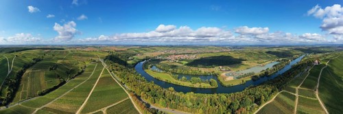 The Mainschleife near Volkach winds through the valley and is surrounded by fields and vineyards. Volkach