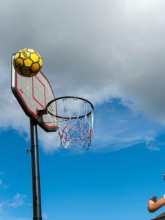 Basketball Jumping with the ball to the basket and net