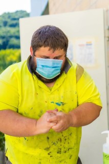 Worker in a recycling factory or clean point and garbage with a face mask and with security protections