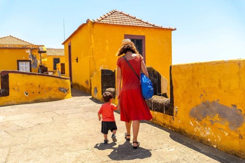 A mother walking with her baby inside the Forte de Sao Tiago in Funchal. Madeira