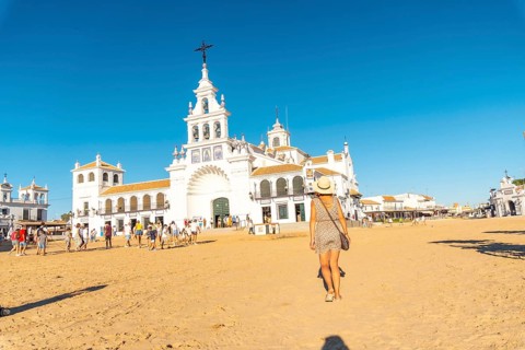 A young tourist visiting the El Rocio sanctuary at the Rocio festival