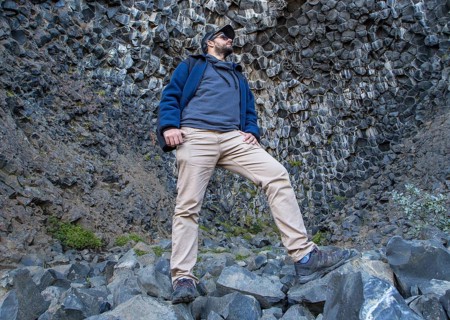 A boy in a fantastic stone shapes on the Jokulsargljufur trekking trail