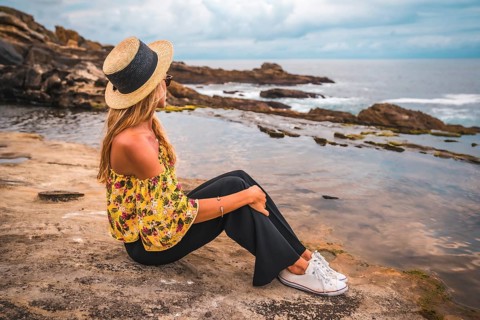 Caucasian blonde girl in a floral shirt