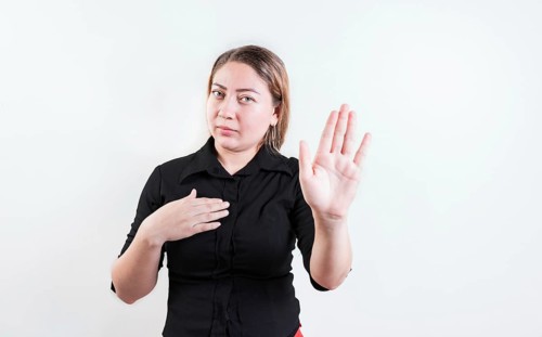 Young woman rejecting with the palm of hand isolated. People gesturing stop isolated. Latin girl gesturing stop with palm hand isolated