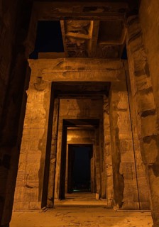 Beautiful columns of the Kom Ombo temple at night illuminated
