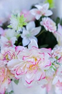 Arrangement with artificial flowers in a cemetery