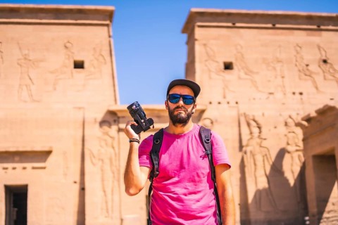A young man in a pink shirt at the Temple of Philae