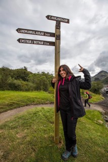 A young woman at the 54 km Thorsmoerk signal of the 4-day trek to Landmannalaugar. Iceland