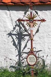Cemetery wall with iron grave cross in the Swabian Open Air Museum