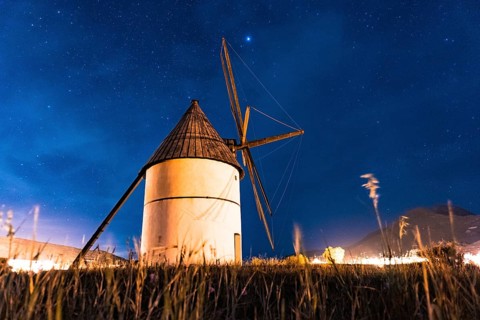 Molino del Pozo de los Frailes at night in the town of San Jose in Cabo de Gata