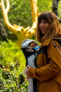 A tourist visiting the Arbre D'or in the Broceliande forest