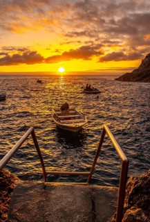 Sunset next to a staircase that goes down to the sea in the town of Poris de Candelaria on the north-west coast of the island of La Palma
