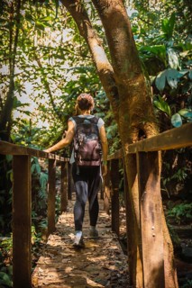 A young tourist inside a bridge in the Cerro Azul Meambar National Park
