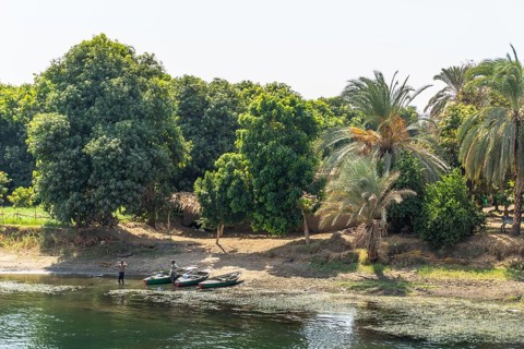 Egyptian local people living on the bank of the river Nile. Views sailing on the cruise on the river Nile from Luxor to Aswer