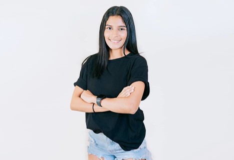 Portrait of beautiful latin girl with arms crossed. Smiling latin girl with arms crossed isolated. Nicaraguan woman on isolated background