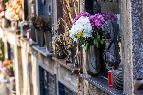 Wall with decorated urns graves in a cemetery in Sardinia