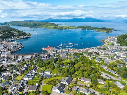 Aerial view of the harbour town of Oban with McCaig's Tower