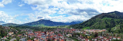 Aerial view of Immenstadt im Allgaeu with a view of the Alps. Immenstadt im Allgaeu