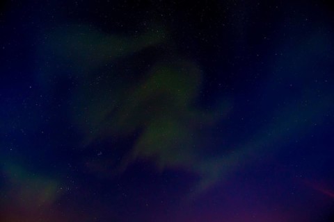 Green lights of the beautiful Northern Lights on the Reykjanes peninsula in southern Iceland