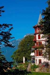 The Historical Grandhotel Giessbach on the Mountain Side in Giessbach