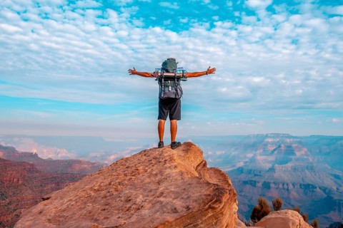 A young man on a viewpoint of the descent of the South Kaibab Trailhead. Grand Canyon