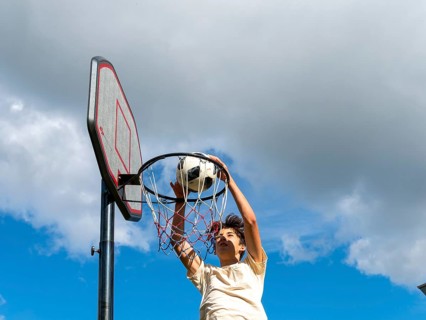 Basketball Jump with the ball to the basket and net