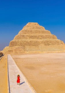 A young woman visiting the Stepped Pyramid of Djoser