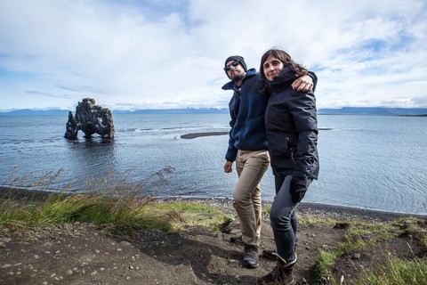 A couple in stone dinosaur in the sea at Hvitserkur