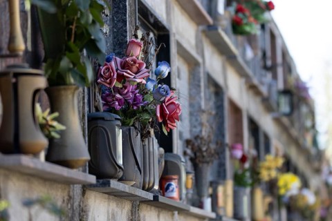 Wall with decorated urns graves in a cemetery in Sardinia