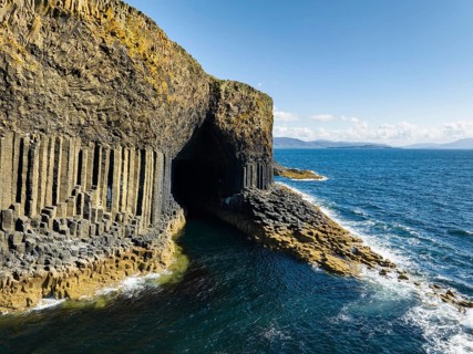 Aerial view of the uninhabited rocky island of Staffa with the prominent basalt columns and Fingal's Cave