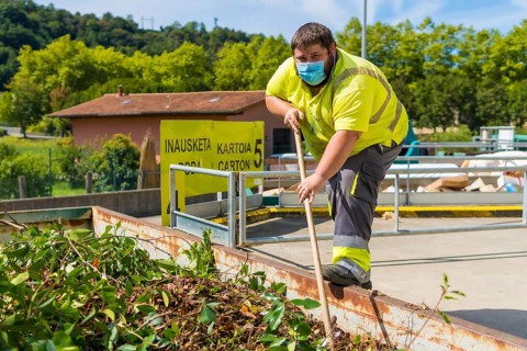 Worker in a recycling factory or clean point and garbage with a face mask and with security protections