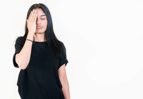 Exhausted people with palm on forehead isolated. Tired and exhausted young girl holding her forehead. Worried young woman holding his forehead
