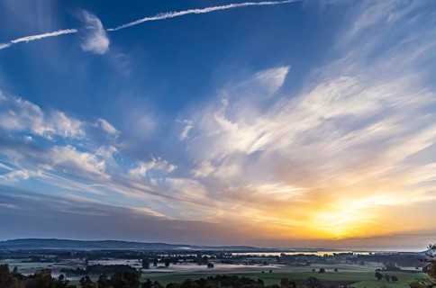 Sunrise at Lake Constance nature reserve Zeller Aachried with autumn fog