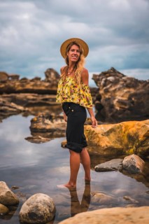 Caucasian blonde girl in a floral shirt