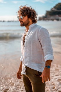 Summer lifestyle with a young dark-haired Caucasian man with long beard