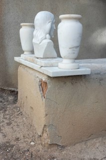 Simple grave with crumbling plaster