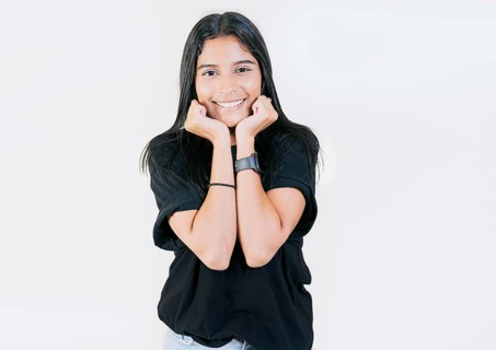 Portrait of friendly latin girl smiling isolated. Close up of Latin American girl face looking and smiling at the camera. Young Nicaraguan woman smiling at camera