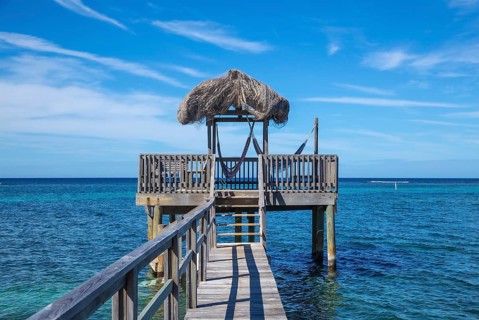 A small wooden house in the Caribbean Sea on Roatan Island. Honduras