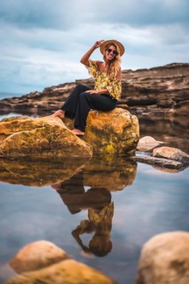 Caucasian blonde girl in a floral shirt