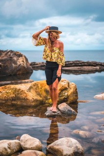 Caucasian blonde girl in a floral shirt
