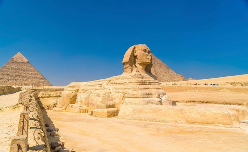 The Great Sphinx of Giza and in the background the Pyramids of Giza