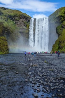 Tourists at the beautiful Skogafoss waterfall in the golden circle of the south of Iceland