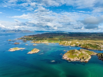 Aerial view of the coastline of the Ross of Mull peninsula with small islands