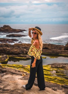 Caucasian blonde girl in a floral shirt