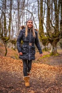 A young woman on the path in the Otzarreta Forest in the Gorbea Natural Park
